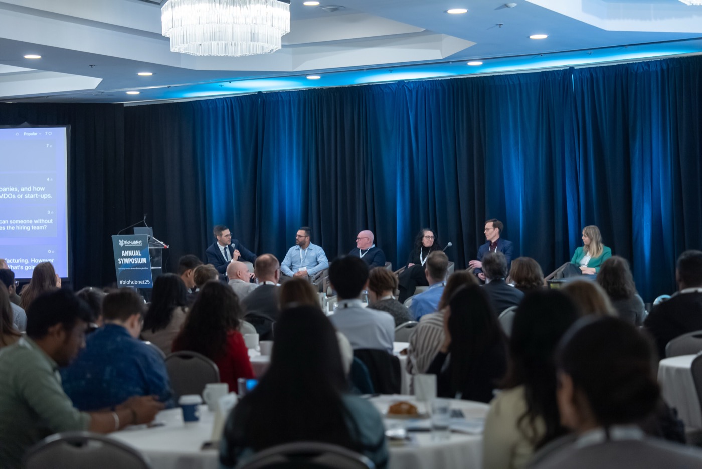 Wide audience view of a panel session