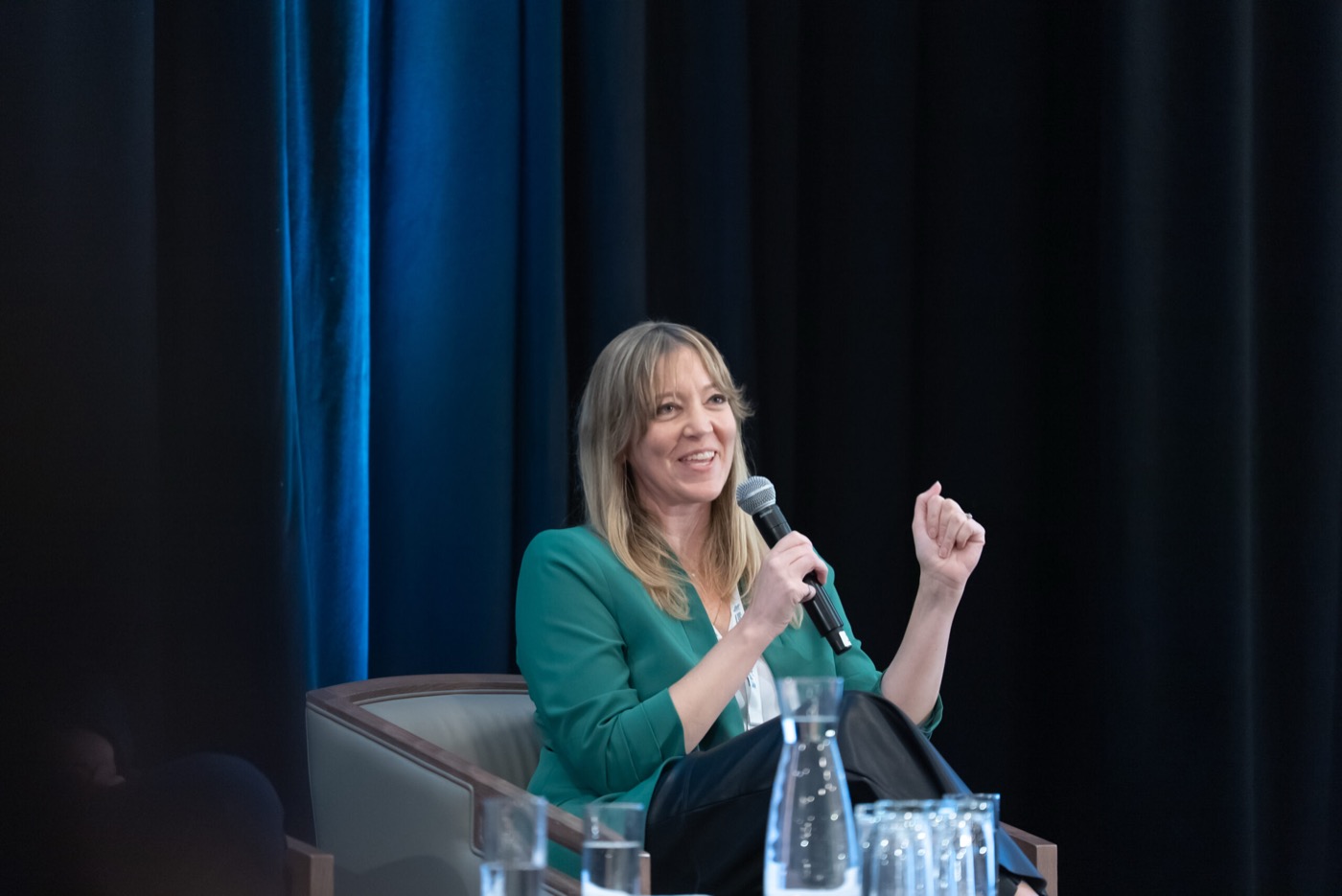 Speaker smiling during a panel response