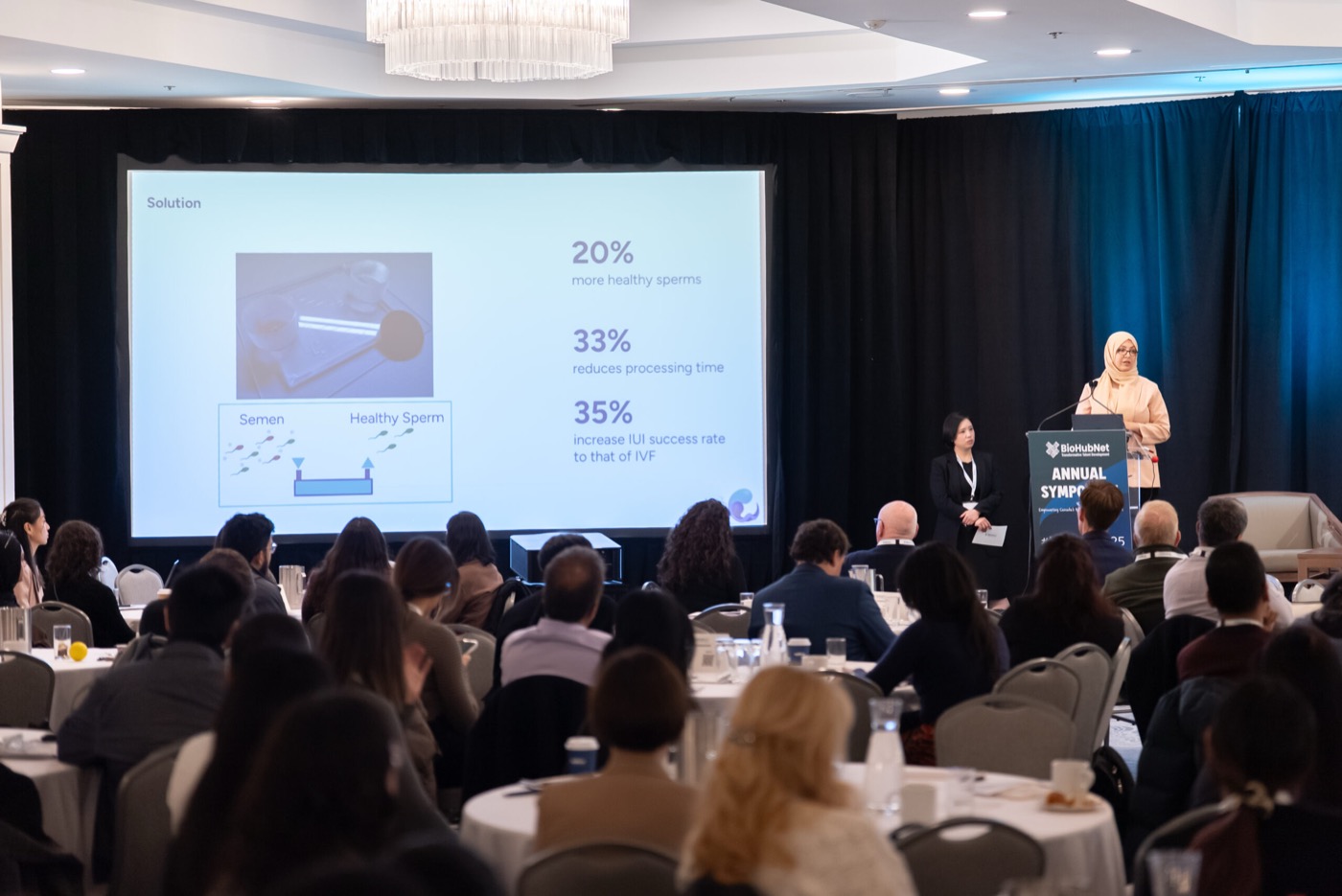 Wide audience view with presentation screen
