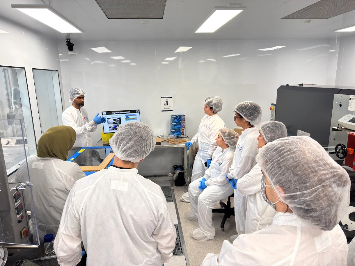 ENGAGE participants receiving practical microfluidics training in a modern laboratory